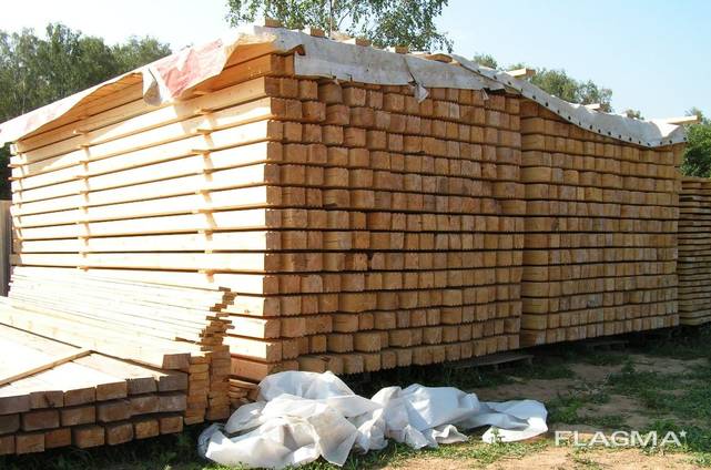 Profiled beam for wooden houses